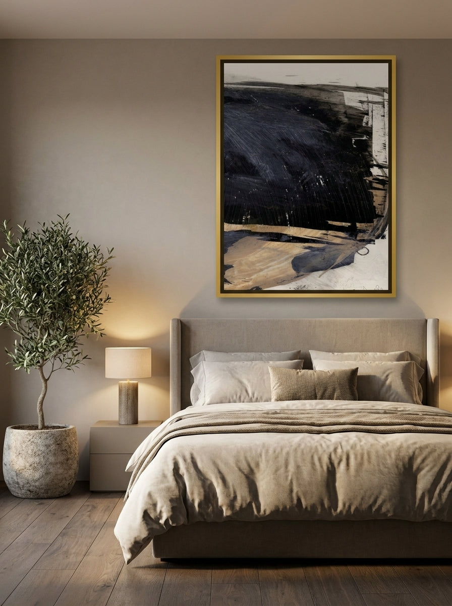 Oversized statement canvas wall art with a gold leaf surround styled on the wall in a luxe bedroom