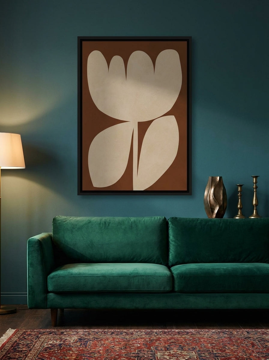 Canvas wall art with a black surround styled on the wall in a moody living room