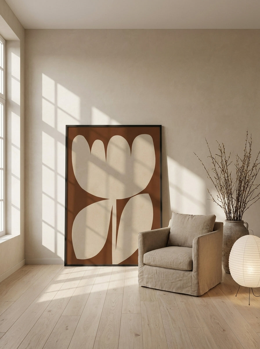 Oversized statement modern wall art print leaning against the wall in a warm Japandi bedroom