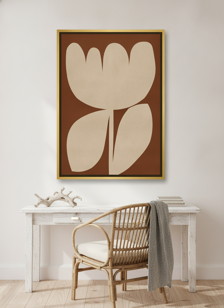 Canvas wall art with a gold leaf surround styled on the wall in a coastal home office