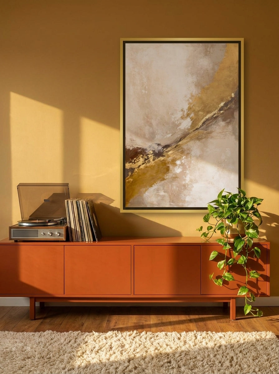 Canvas wall art with a gold leaf surround styled on the wall in a retro 70s living room