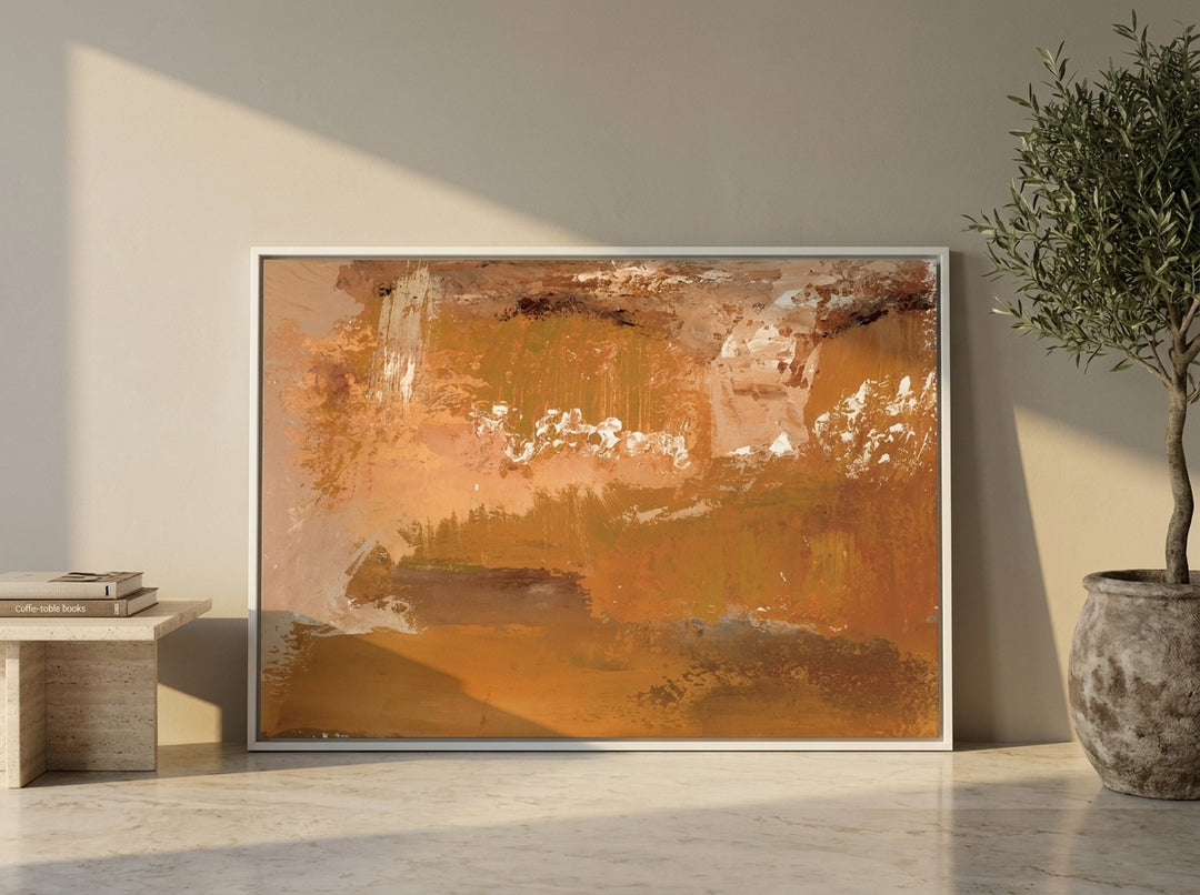 Oversized statement canvas wall art with a white surround leaning against the wall in a luxe living room