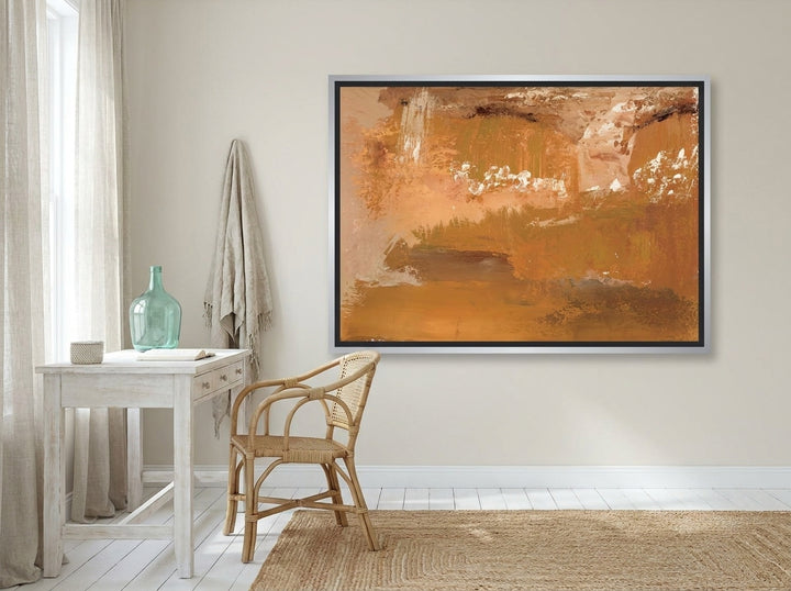 Canvas wall art with a silver leaf surround styled on the wall in a coastal home office