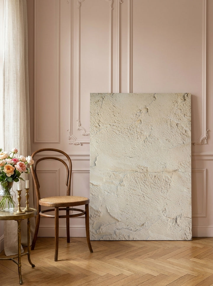 Stretched canvas wall art leaning against the wall in a Parisian bathroom