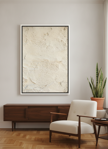 Oversized statement canvas wall art with a white surround styled on the wall in a mid-century living room