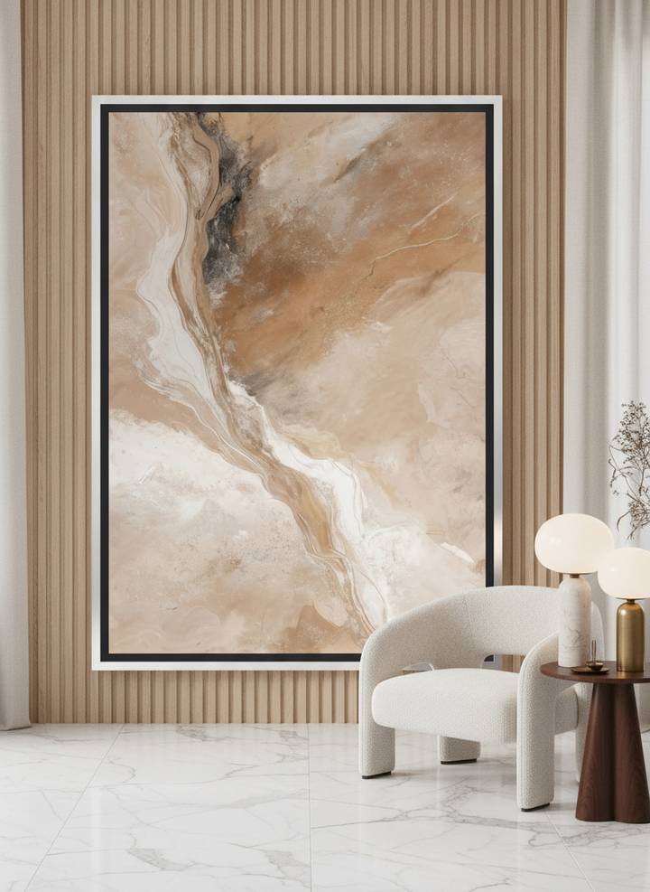 Oversized statement canvas wall art with a silver leaf surround leaning against the wall in a luxe dining room