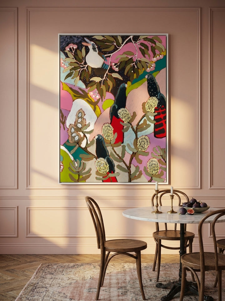 Oversized statement canvas wall art with a white surround styled on the wall in a Parisian dining room