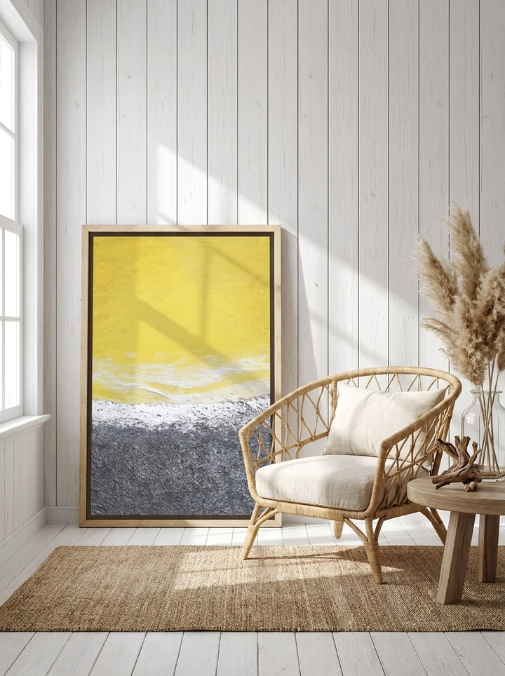 Oversized statement canvas wall art with a natural timber surround leaning against the wall in a coastal bedroom
