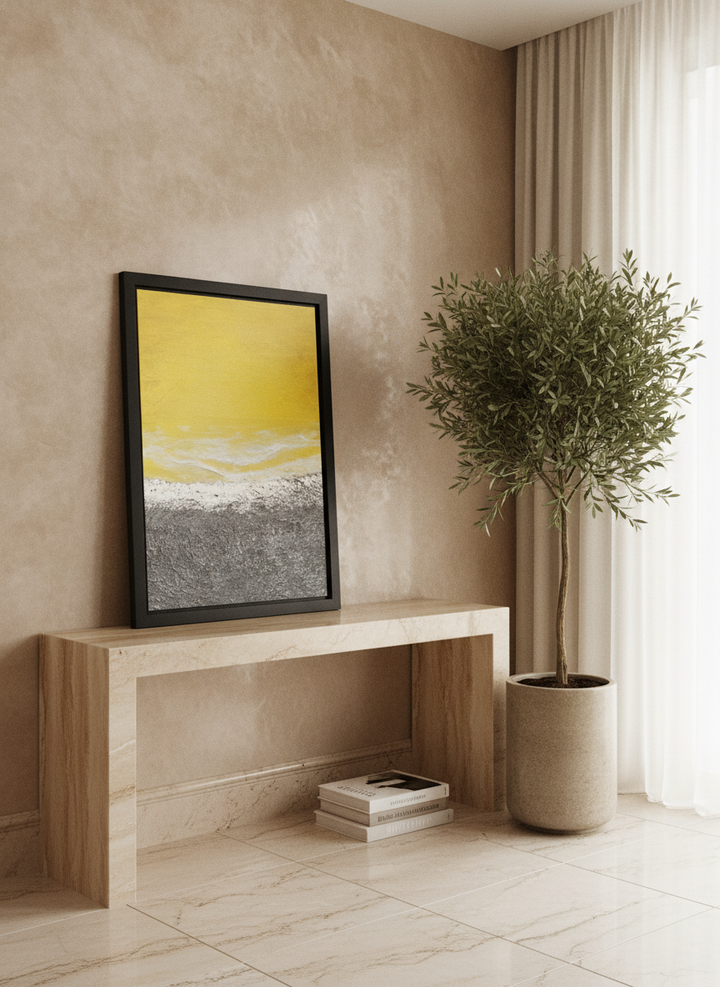 Modern wall art print standing on a console in a luxe living room