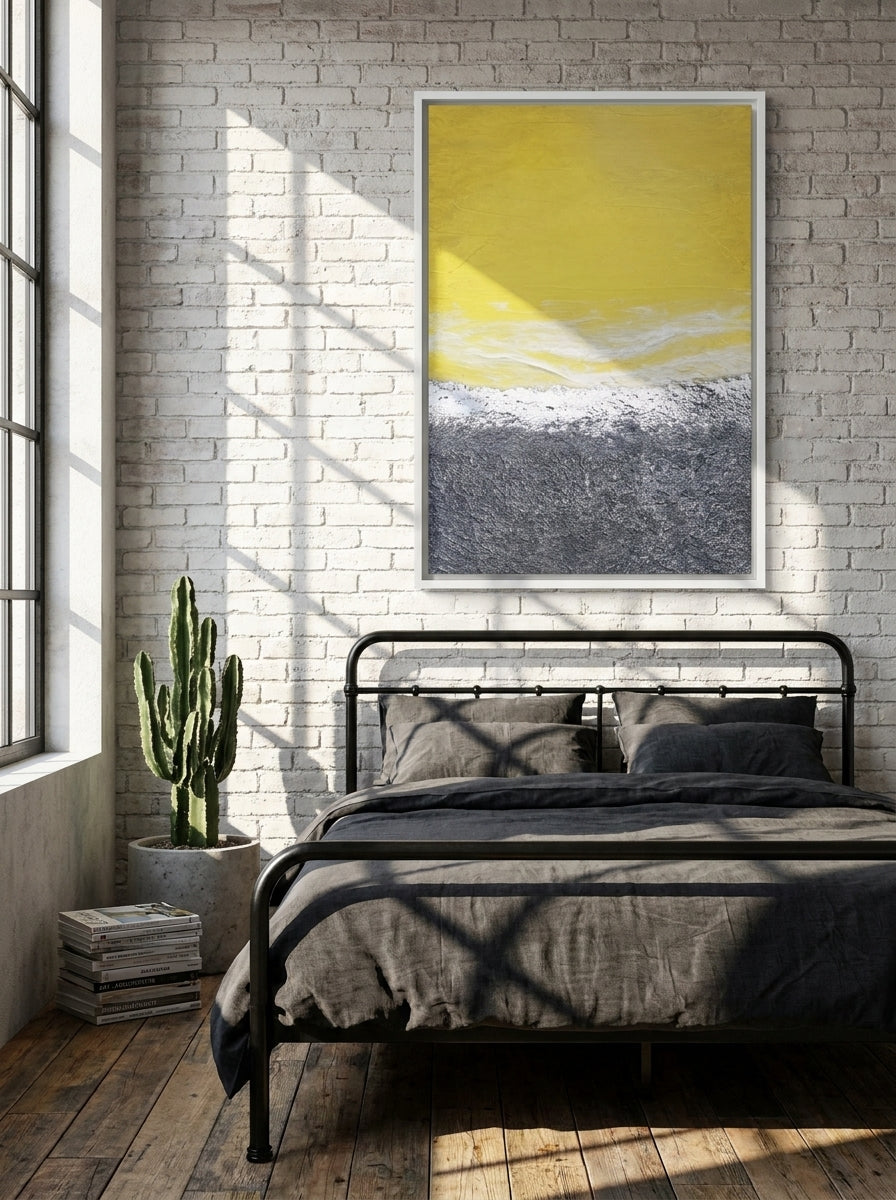 Canvas wall art with a white surround styled on the wall in an industrial loft bedroom