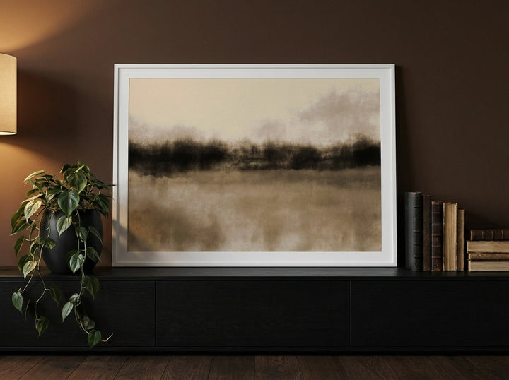Modern wall art print standing on a console in a moody bedroom