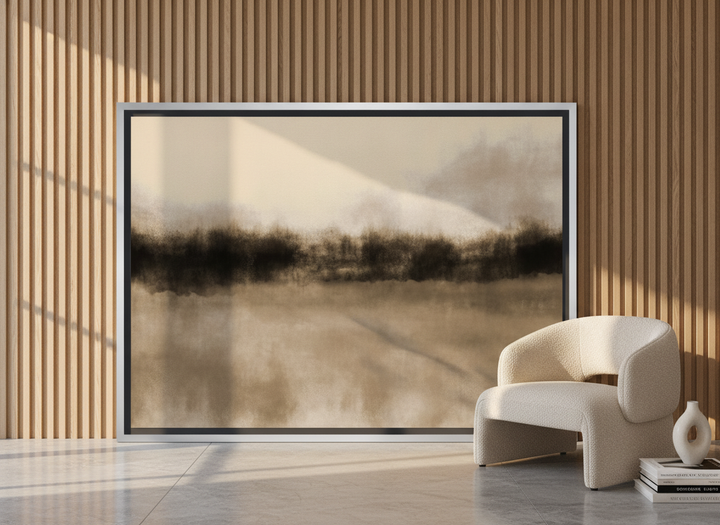 Oversized statement canvas wall art with a silver leaf surround leaning against the wall in a luxe bedroom