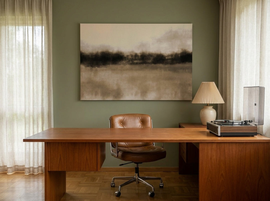 Stretched canvas wall art styled on the wall in a mid-century home office