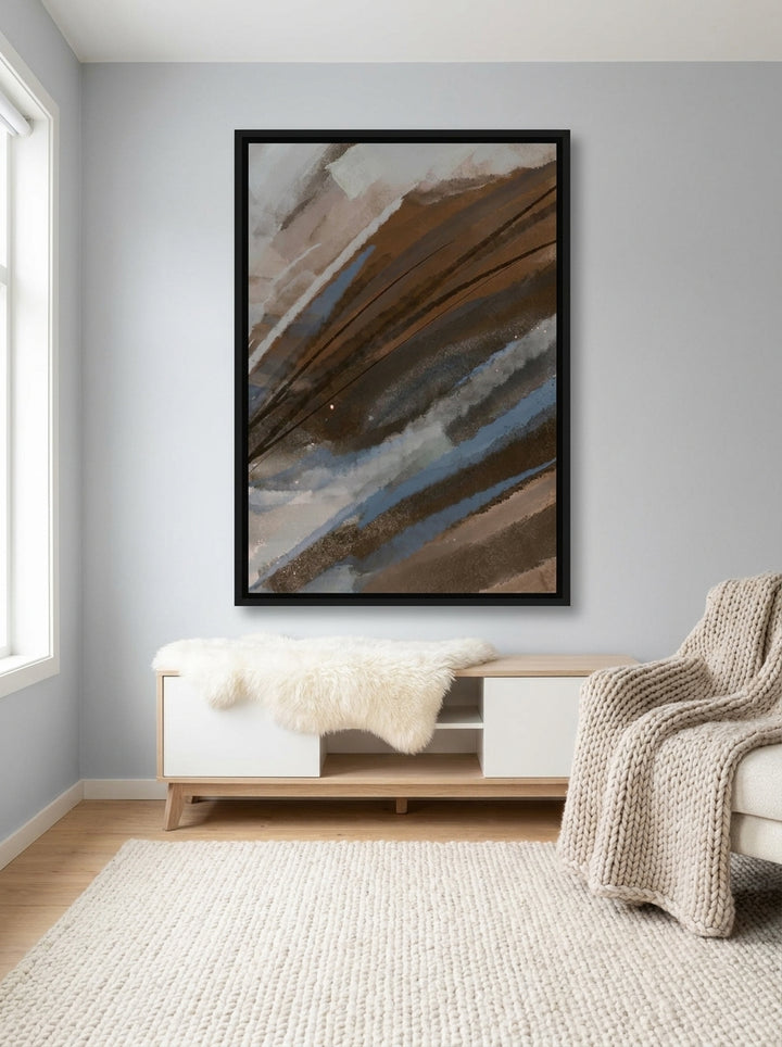 Canvas wall art with a black surround styled on the wall in a bright Scandinavian living room