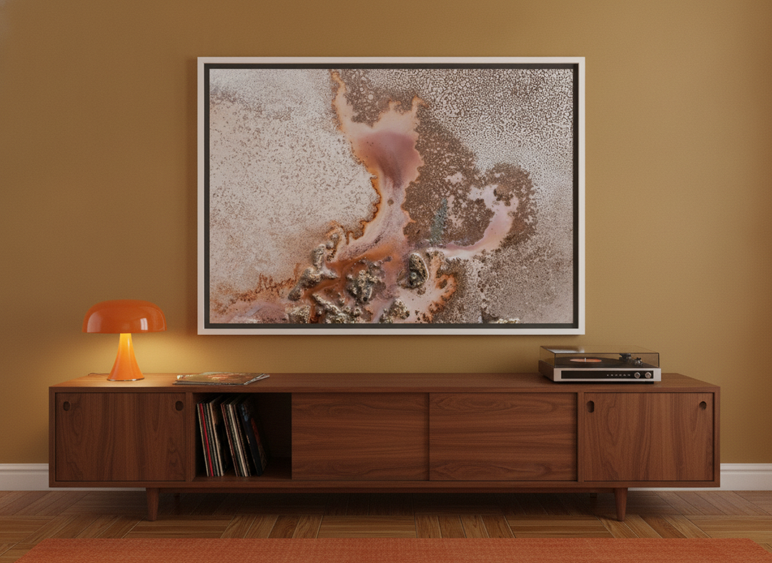 Canvas wall art with a white surround standing on a sideboard in a retro 70s home office