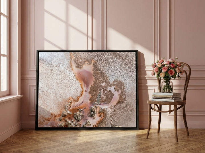 Canvas wall art with a black surround leaning against the wall in a Parisian bathroom