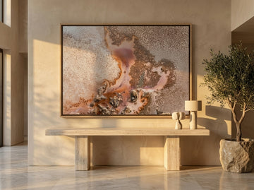 Oversized statement canvas wall art with a natural timber surround styled on the wall in a luxe living room