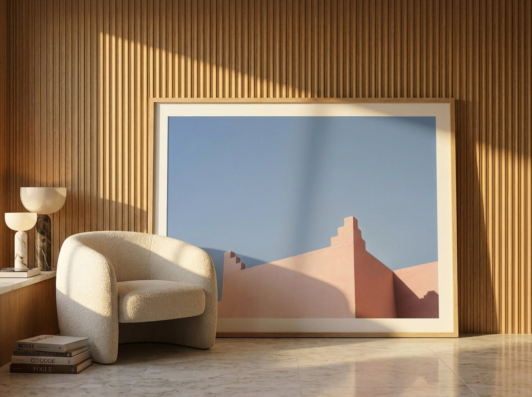Oversized statement modern wall art print leaning against the wall in a luxe living room