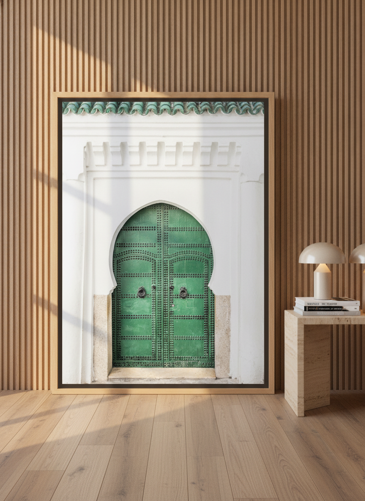 Oversized statement canvas wall art with a natural timber surround leaning against the wall in a luxe bedroom