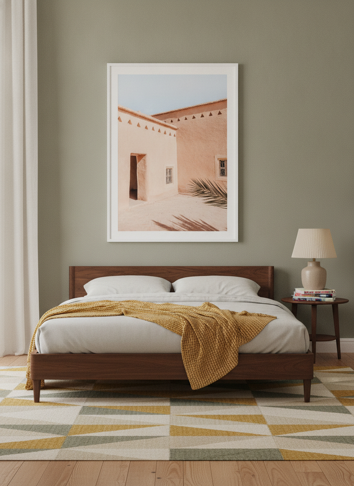 Modern wall art print styled on the wall in a mid-century bedroom