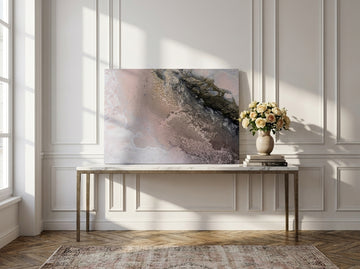 Stretched canvas wall art standing on a console in a Parisian home office