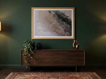 Modern wall art print styled on the wall in a moody living room