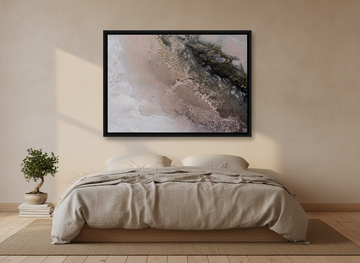 Canvas wall art with a black surround styled on the wall in a warm Japandi bedroom
