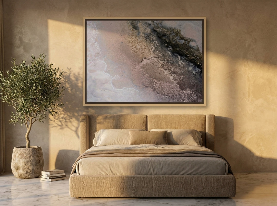 Oversized statement canvas wall art with a natural timber surround styled on the wall in a luxe bedroom