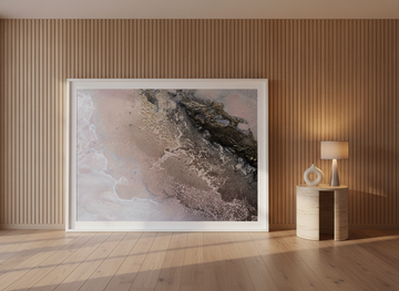 Oversized statement modern wall art print leaning against the wall in a luxe living room