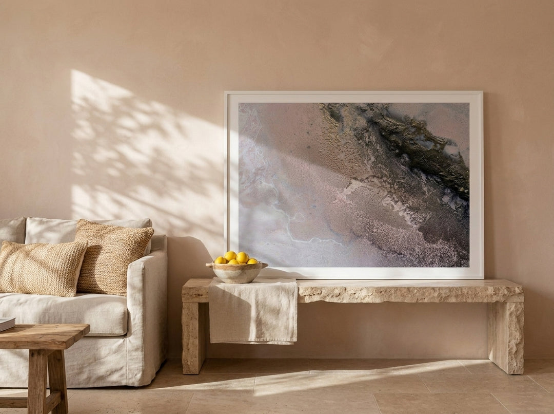Modern wall art print standing on a console in a Mediterranean living room