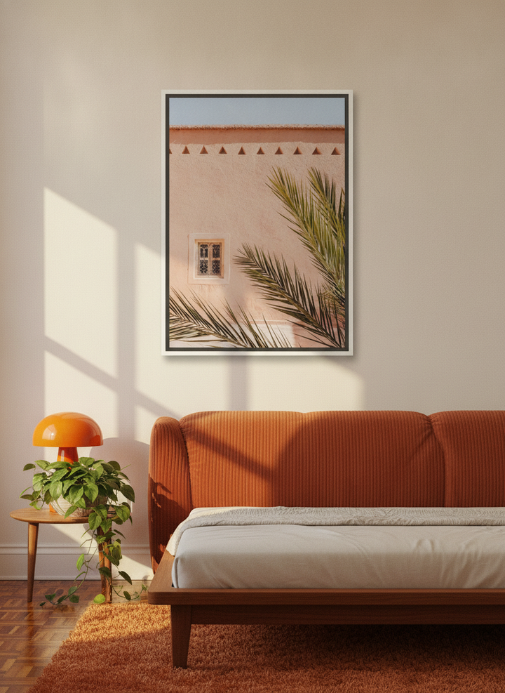 Canvas wall art with a white surround styled on the wall in a retro 70s bedroom