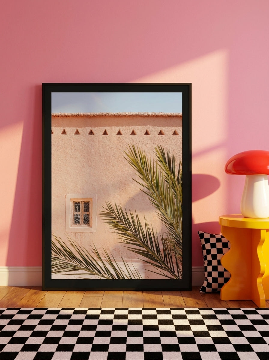 Oversized statement modern wall art print leaning against the wall in a colourful eclectic living room