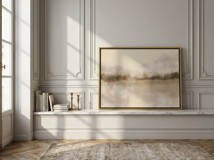 Canvas wall art with a gold leaf surround standing on a console in a Parisian home office