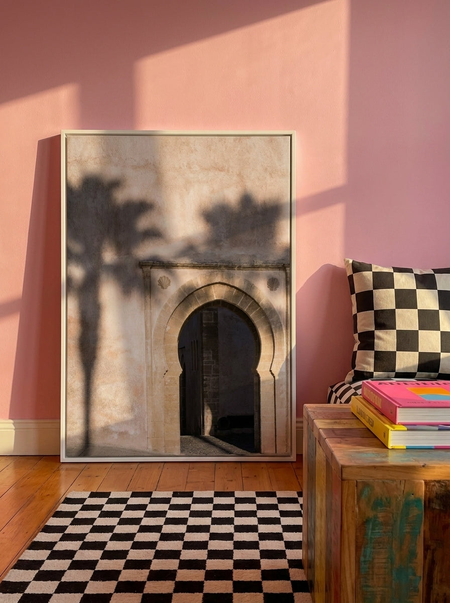Canvas wall art with a white surround standing on a side table in a colourful eclectic home office