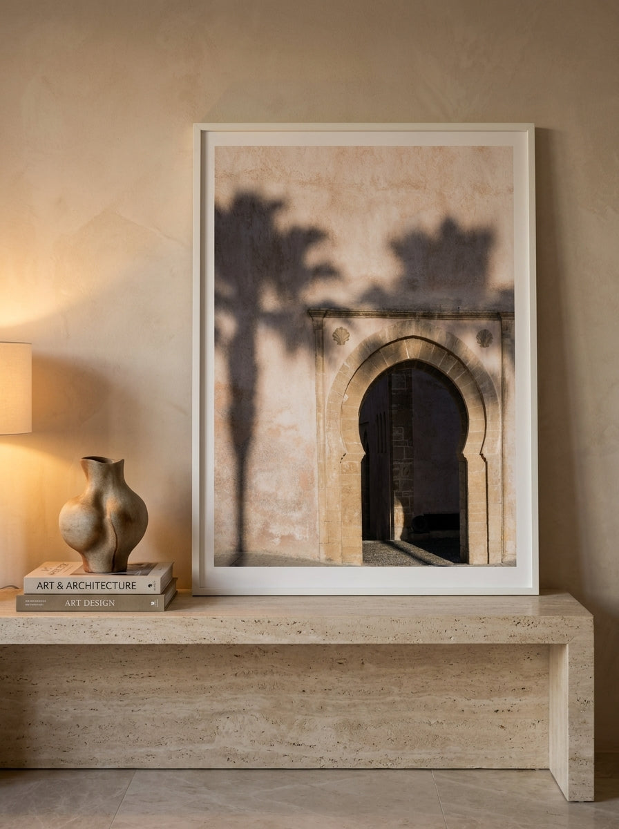 Modern wall art print standing on a console in a luxe bedroom