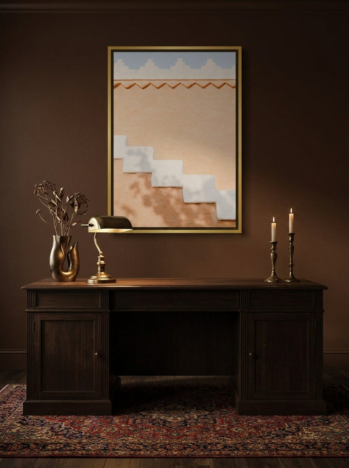 Canvas wall art with a gold leaf surround styled on the wall in a moody home office