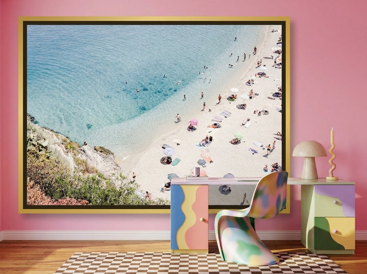 Oversized statement canvas wall art with a gold leaf surround styled on the wall in a colourful eclectic home office