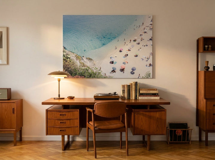 Stretched canvas wall art styled on the wall in a mid-century home office
