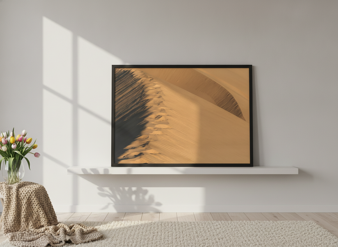 Modern wall art print standing on a shelf in a bright Scandinavian living room