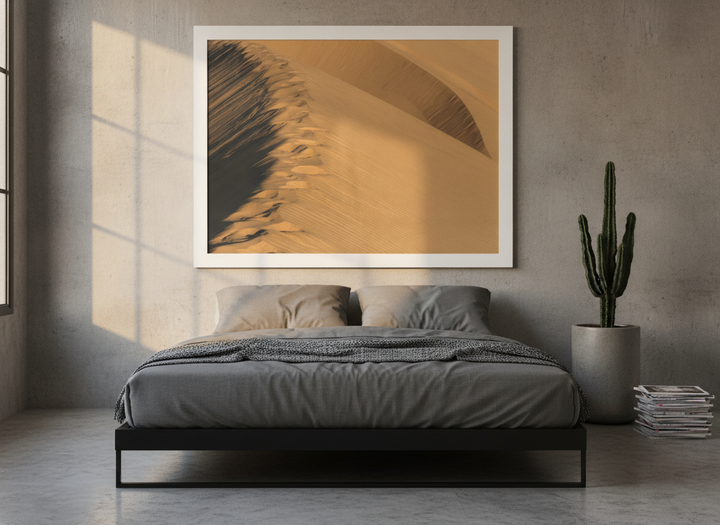 Modern wall art print styled on the wall in an industrial loft bedroom