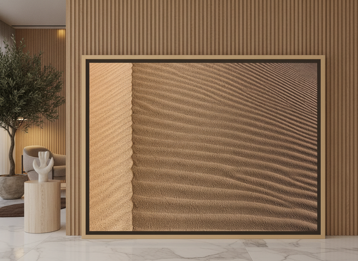 Oversized statement canvas wall art with a natural timber surround leaning against the wall in a luxe bedroom