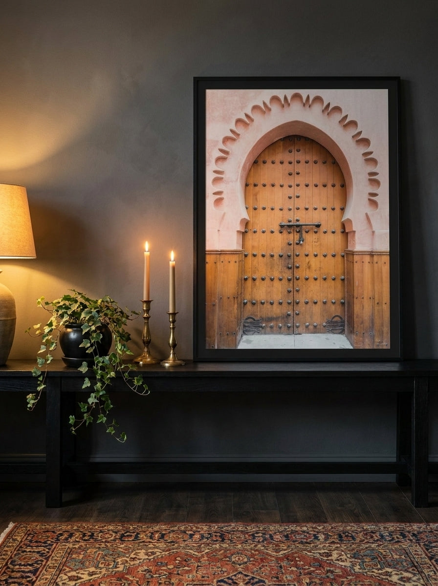 Modern wall art print standing on a console in a moody home office
