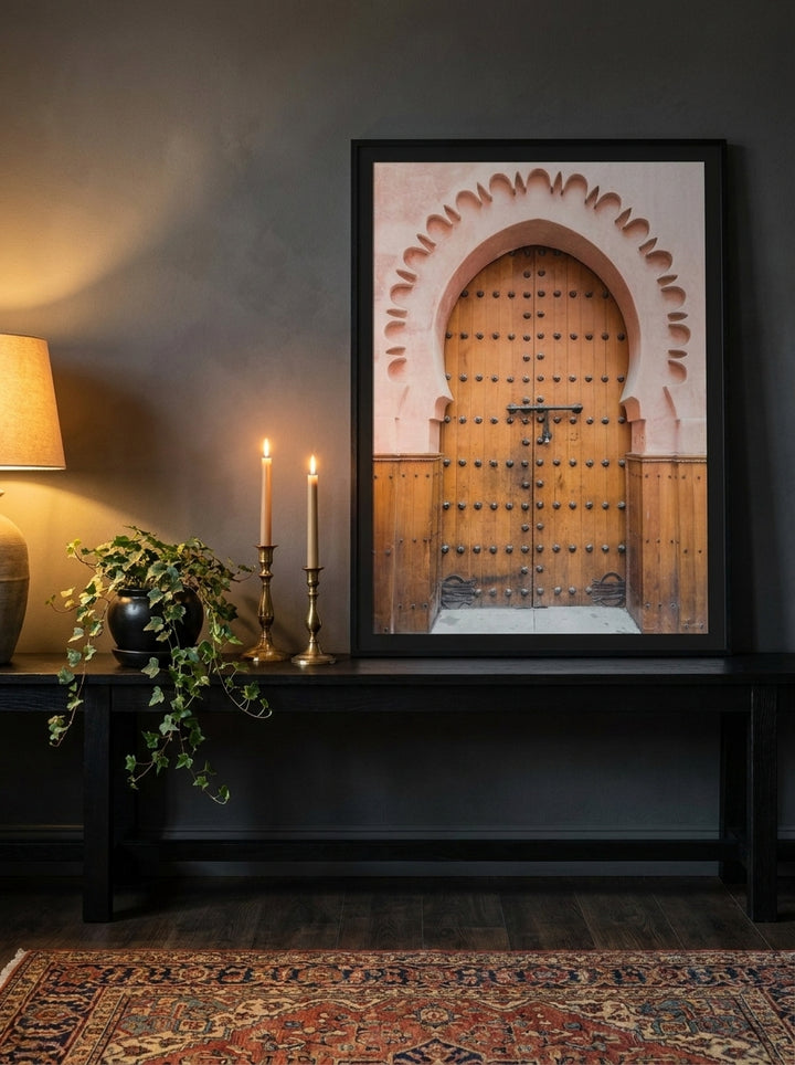 Modern wall art print standing on a console in a moody home office