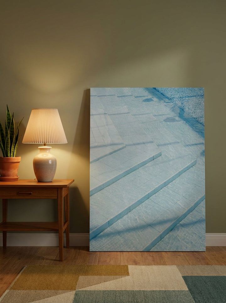 Stretched canvas wall art leaning against the wall in a mid-century living room
