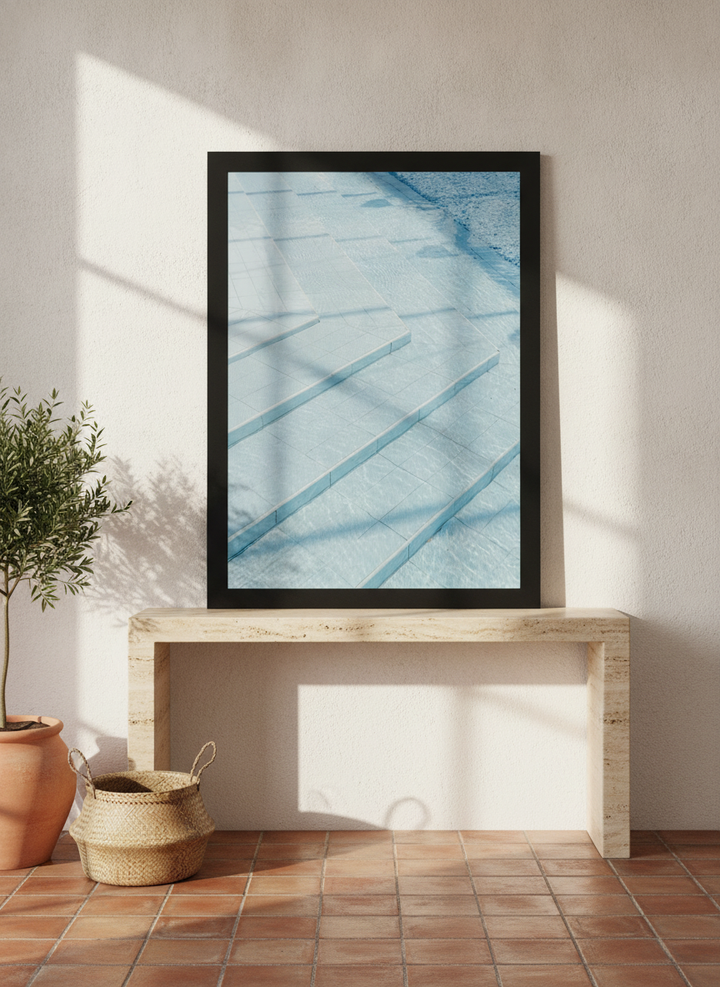 Modern wall art print standing on a console in a Mediterranean home office