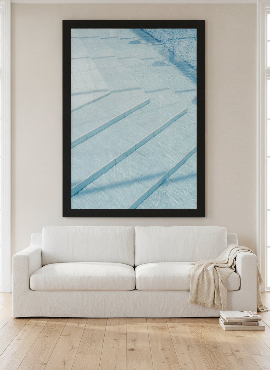 Oversized statement modern wall art print styled on the wall in a coastal living room