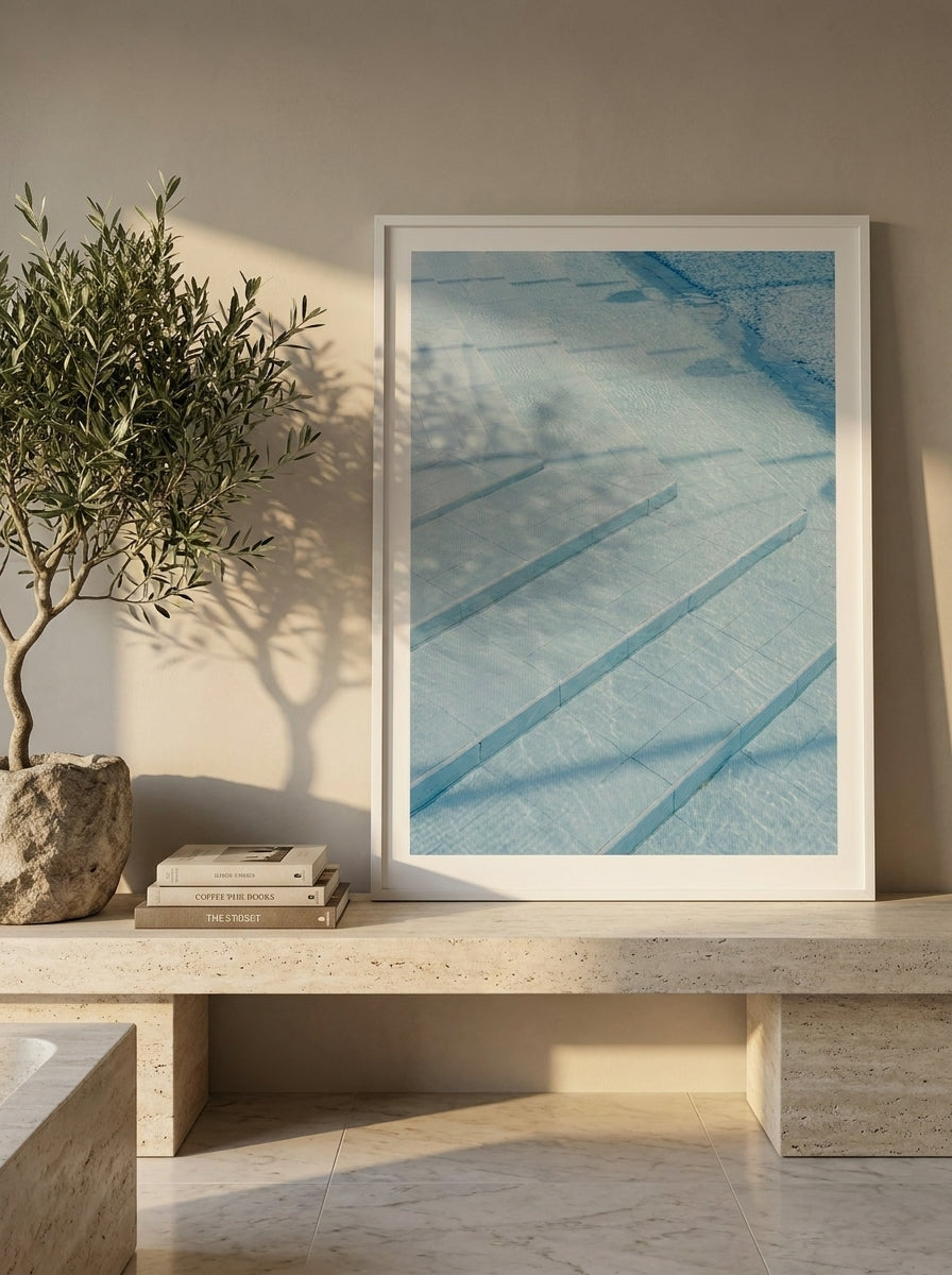 Modern wall art print standing on a console in a luxe bathroom