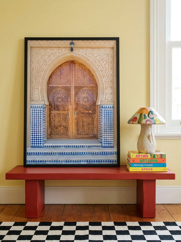 Modern wall art print standing on a side table in a colourful eclectic home office