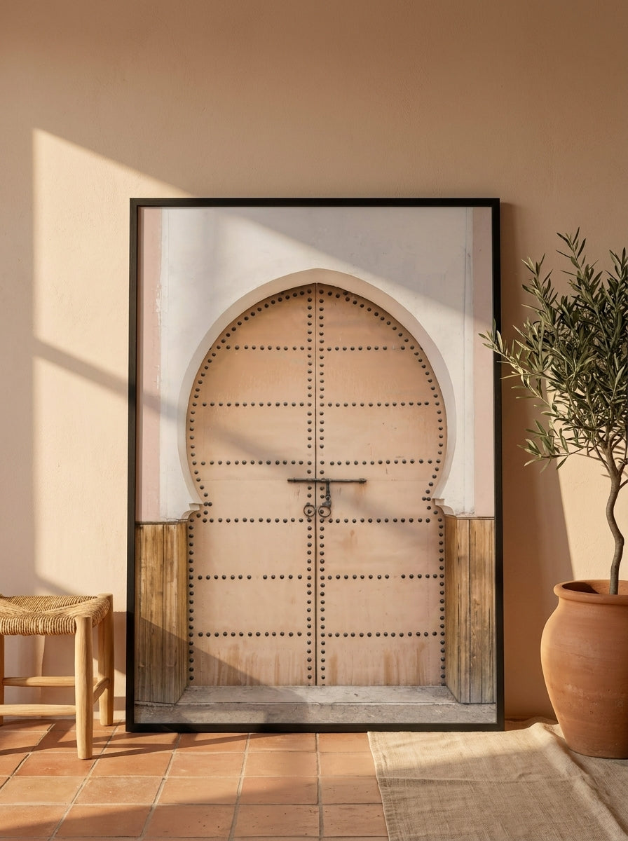 Oversized statement modern wall art print leaning against the wall in a Mediterranean bedroom