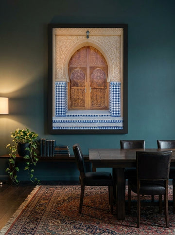 Oversized statement modern wall art print styled on the wall in a moody dining room